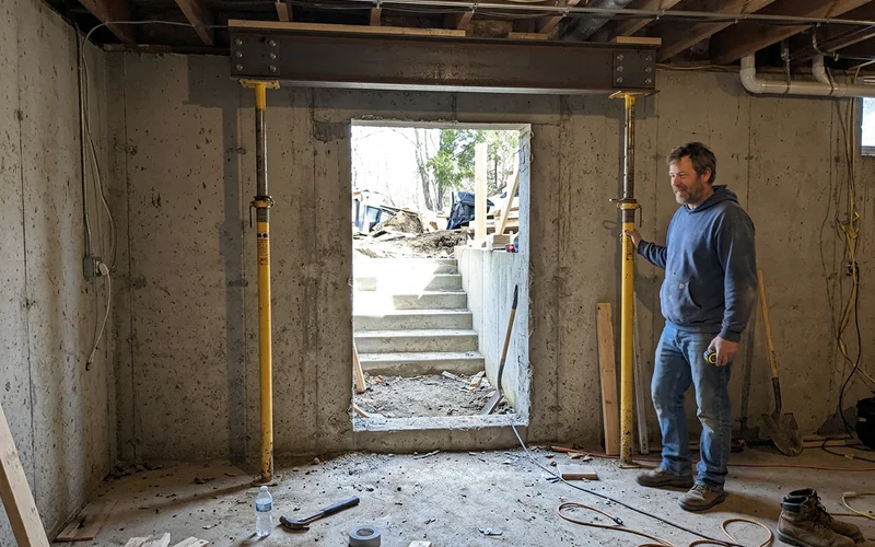 New walkout door opening with an engineered header in a foundation wall